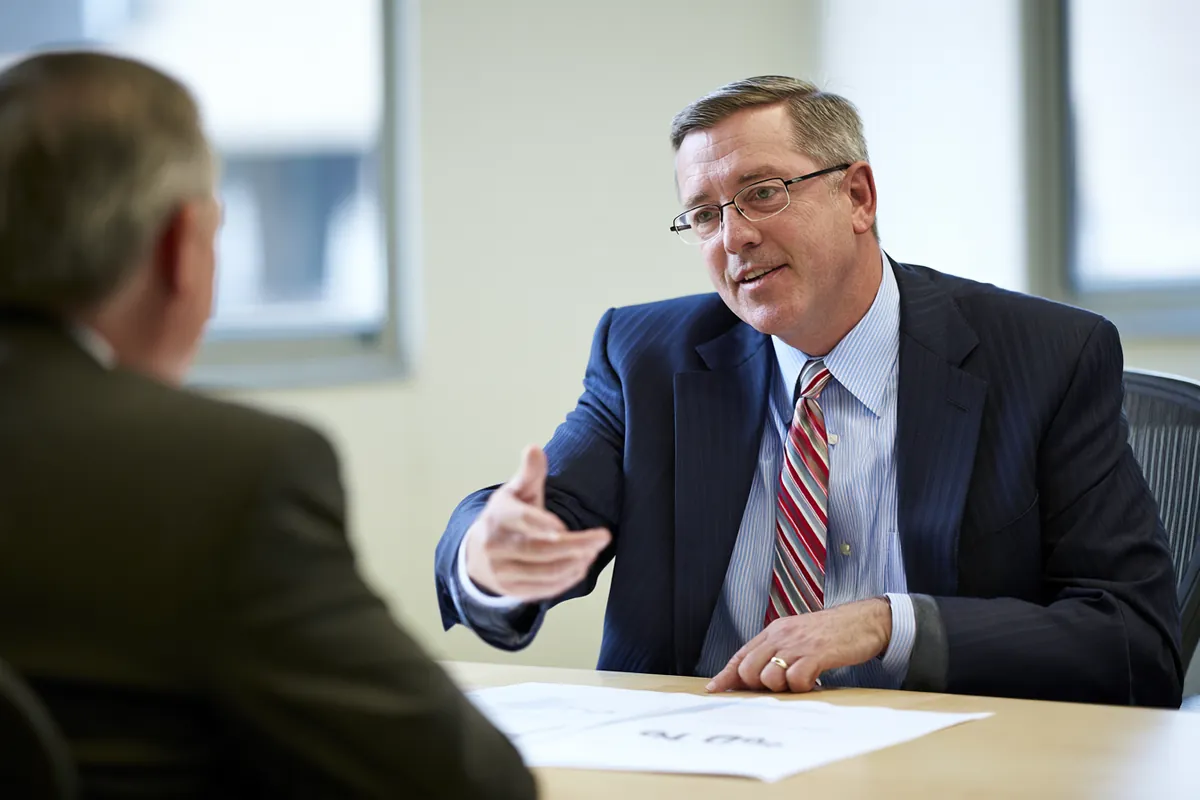 Advisor walking a borrower through where personal loan rates land and why